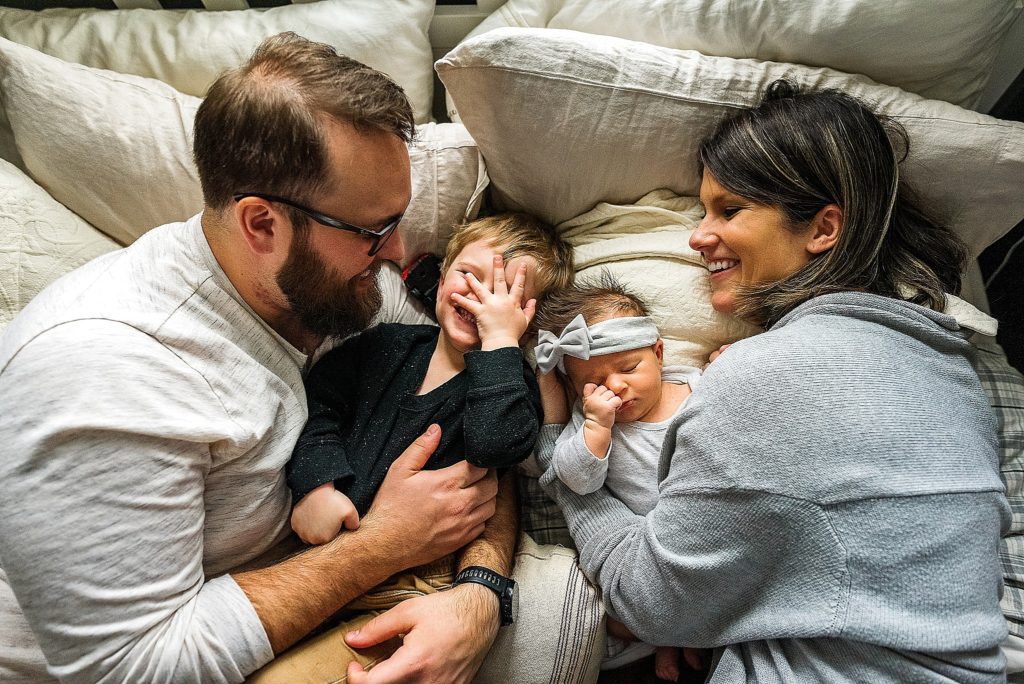 Charlotte Lifestyle Photographer also serving Mooresville Davidson Cornelius Huntersville specializes in family newborn branding natural fun moments in home family session family in bed together relaxed happy