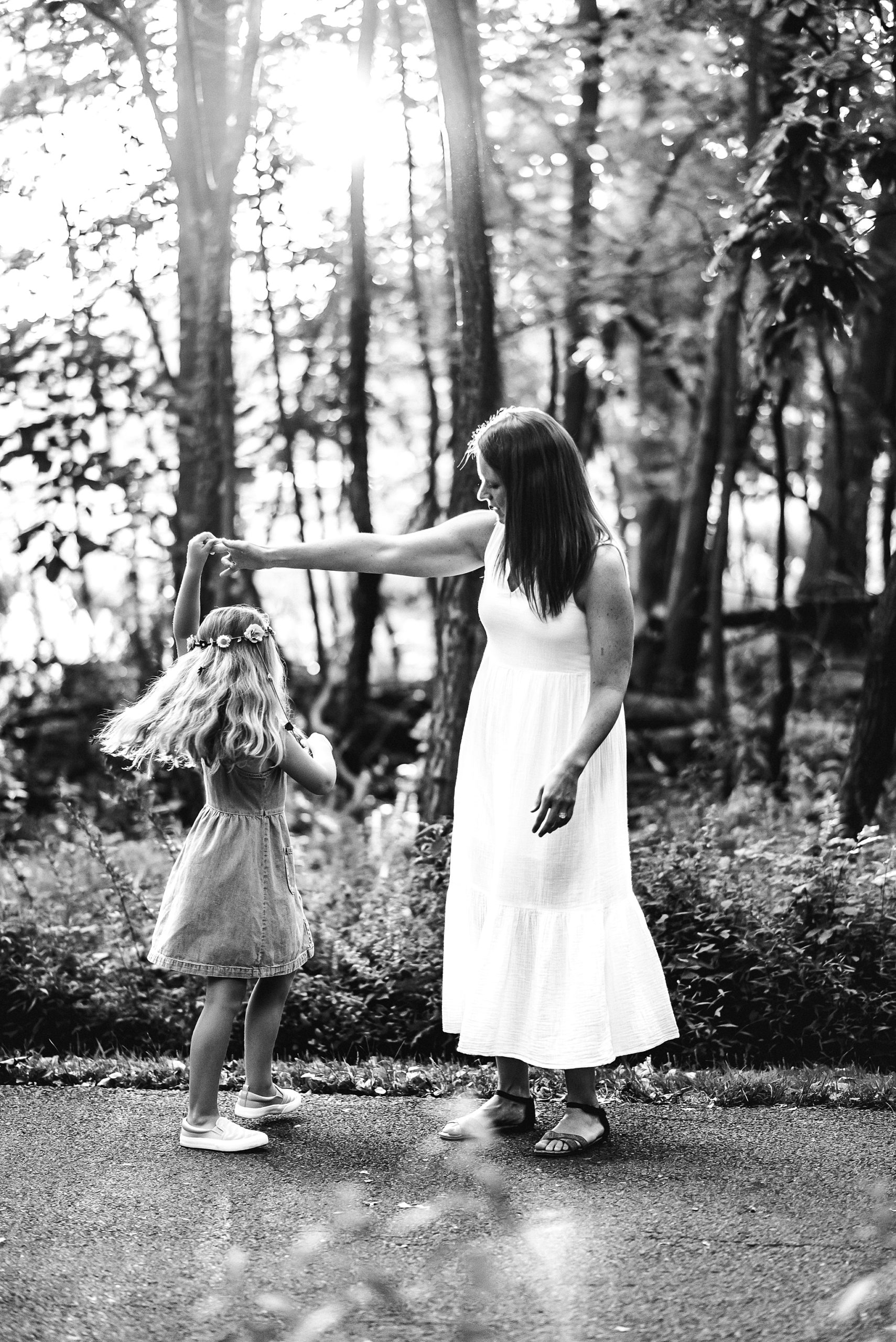 black and white photography mom and daughter dancing